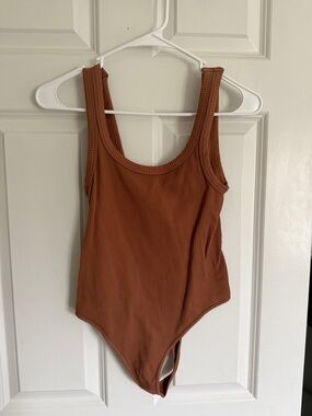 Nikibiki Ribbed Scoop Neck Bodysuit in Rust